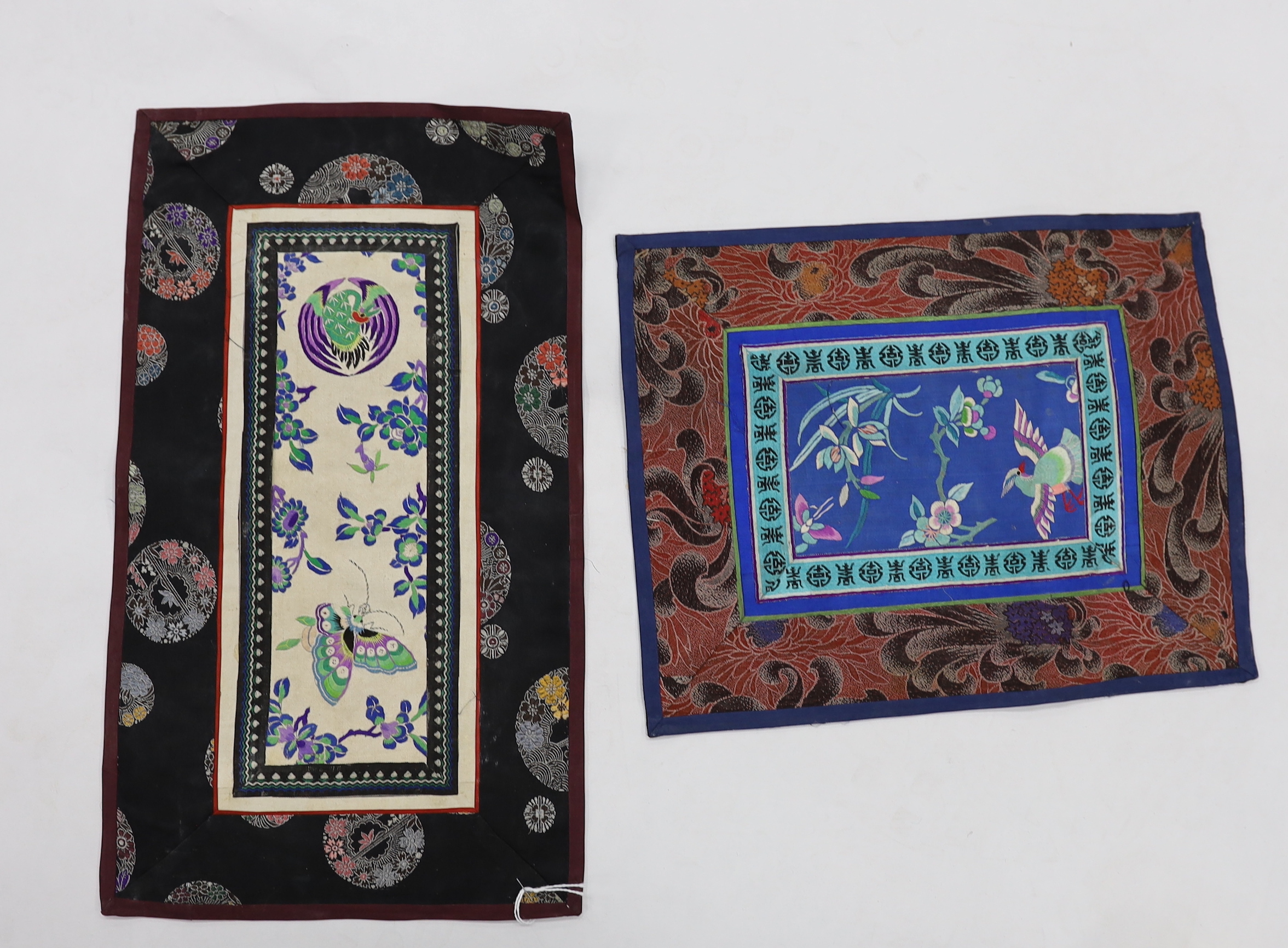 Twelve various Chinese rectangular silk polychrome embroidered mats with damask borders, of varying sizes